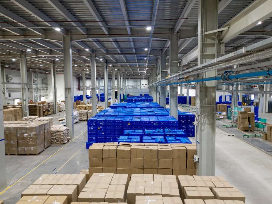 Warehouse with stacked blue crates