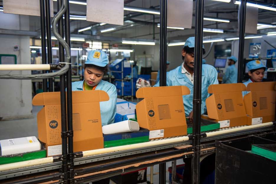 Workers operating an assembly line